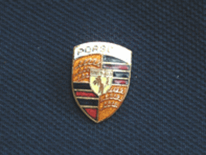 Crested lapel pin.